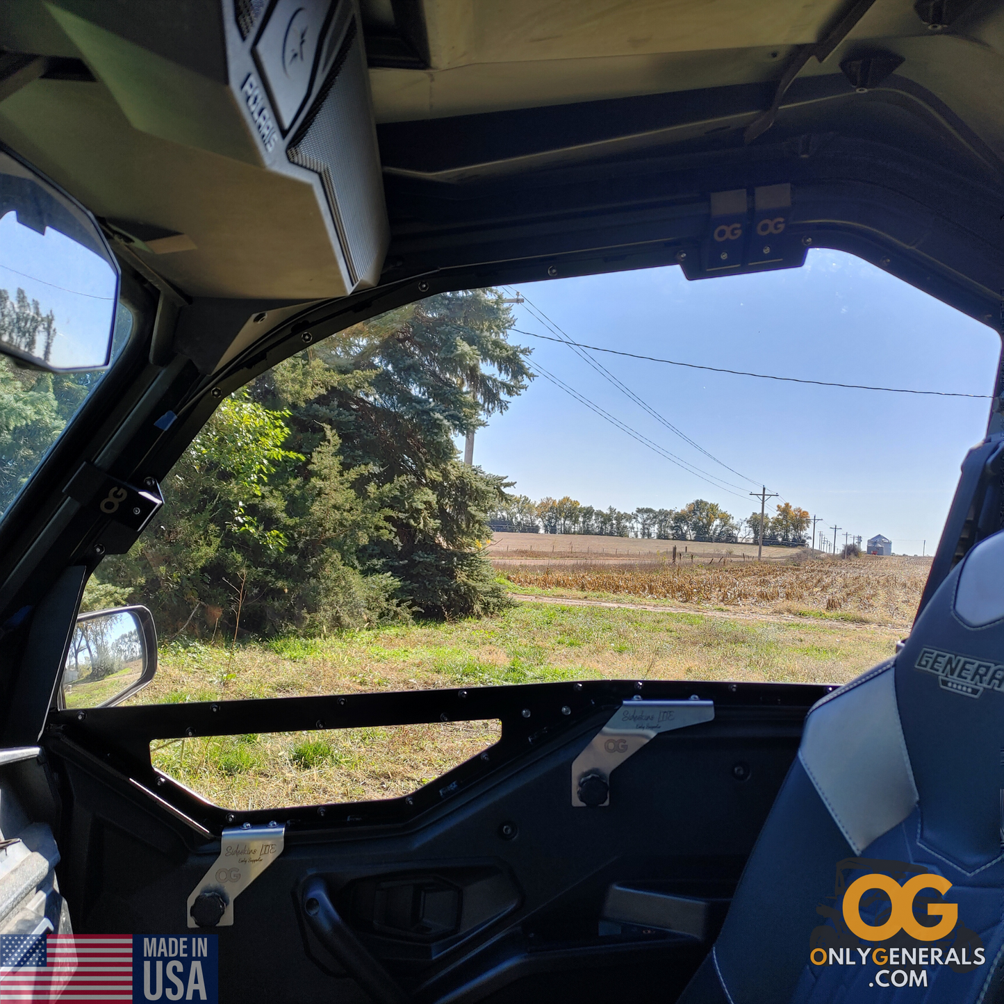 An interior photo of a Polaris General with the OnlyGenerals SideskinsLITE hard upper doors installed