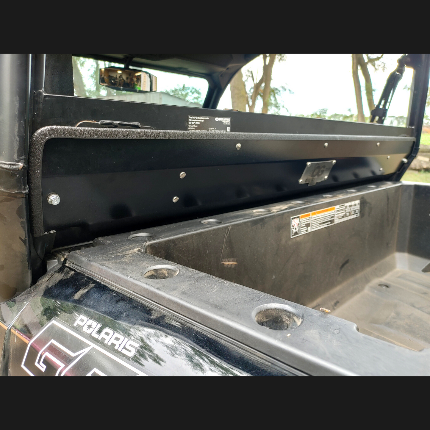 Close up rear view of OnlyGenerals rear lower filler panel kit intalled on a Polaris General