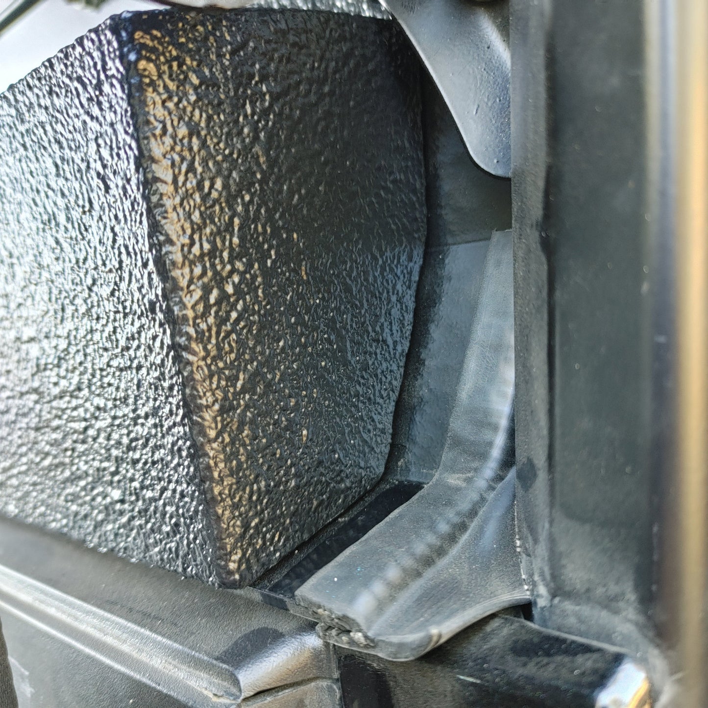 Side view close up showing the precise fitment of the OnlyGenerals full length storage tray to the OG rear filler panel for the Polaris General