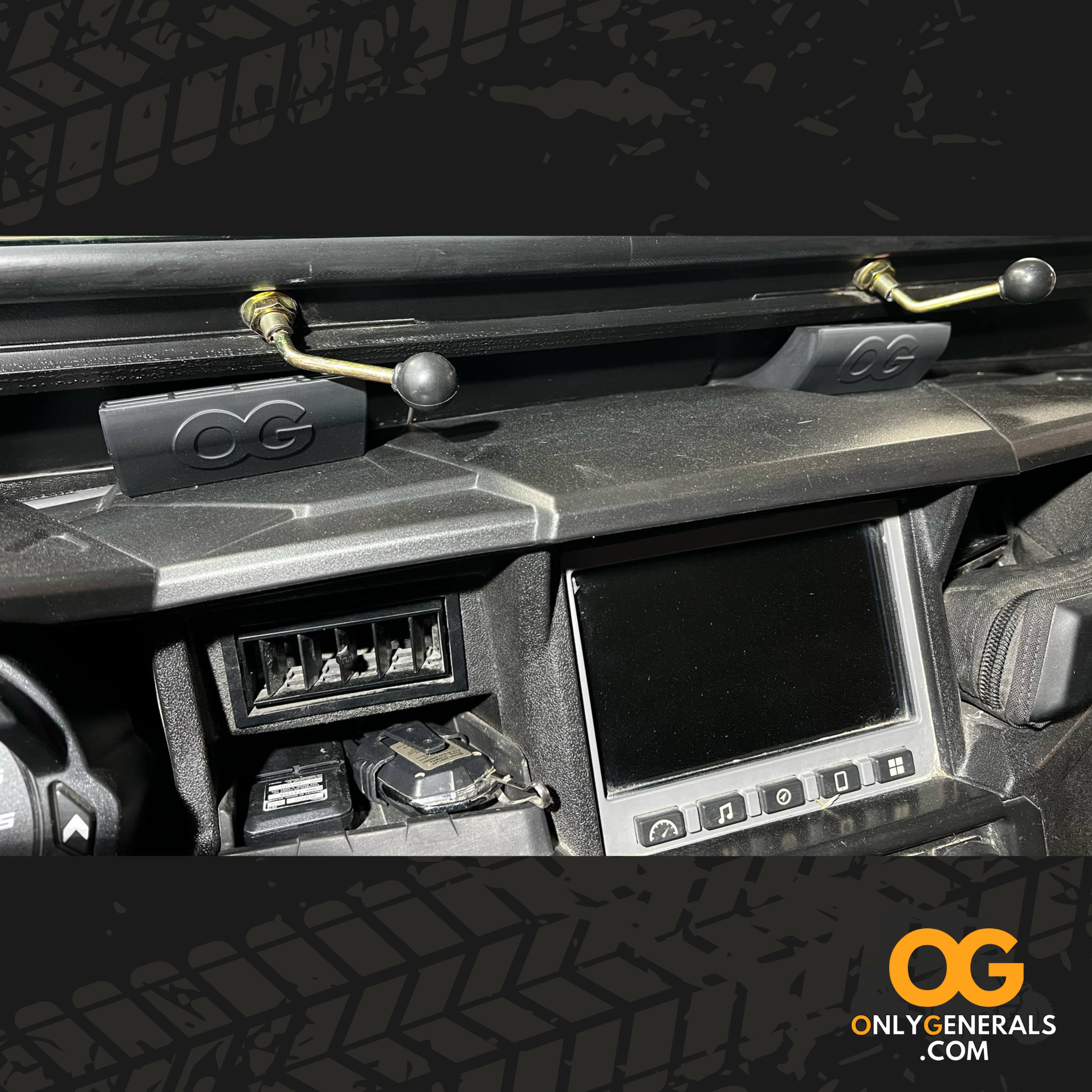 Close-up of a Polaris Generals dashboard with 'OG' branded vent extenders.