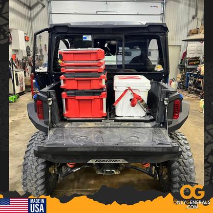 Showing the OG versarak mounted in a polaris general with milwaukee packout boxes & a cooler strapped down.