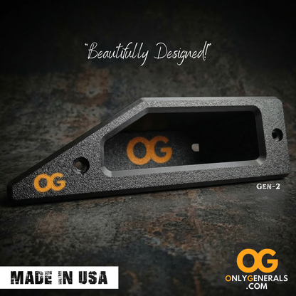 A beautifully designed OnlyGenerals recessed door handle for the Polaris General laying on a textured surface. Showing the OG logo and MADE IN USA stamp