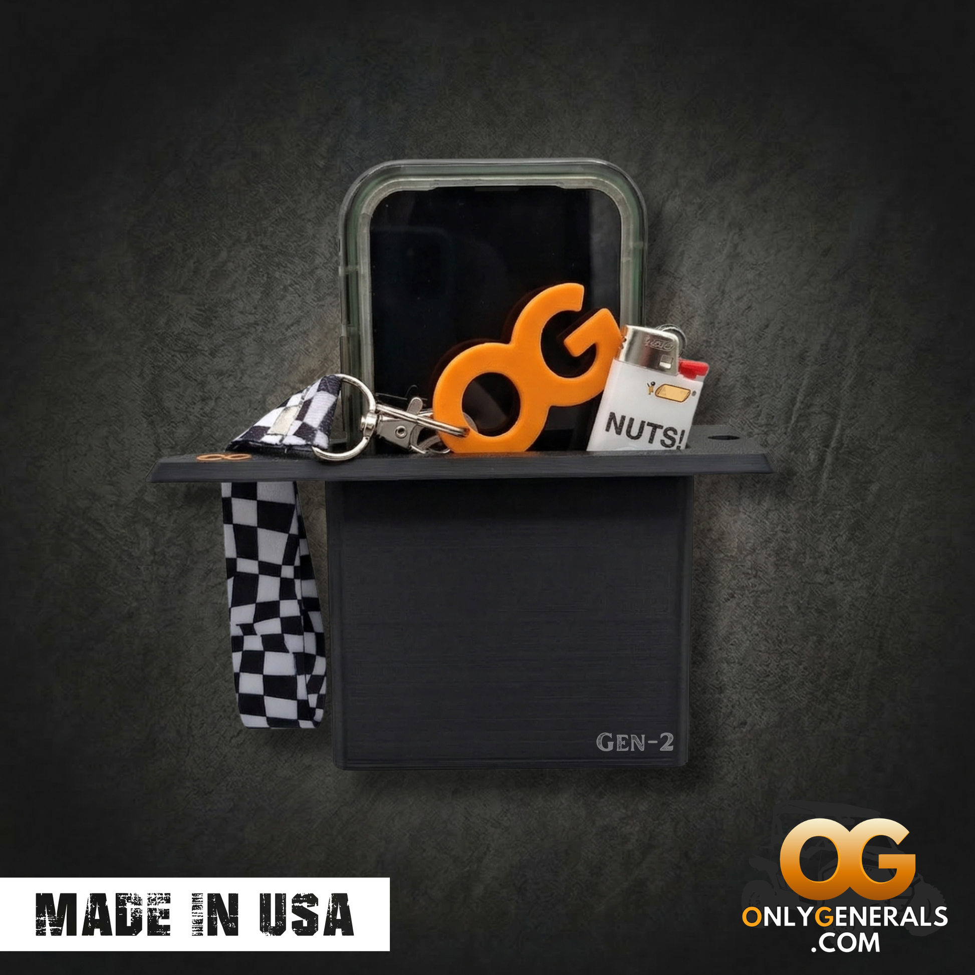An OnlyGenerals recessed door pull handle with a cell phone, OG Keychain, and lighter tucked into the recessed pocket of the handle for a Polaris General. A made in USA stamp and OG logo is along the bottom.