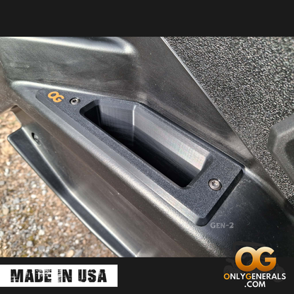 Showing a driver door with the OnlyGenerals recessed door handle for the Polaris General installed.  A made in USA stamp and OG logo is along the bottom.