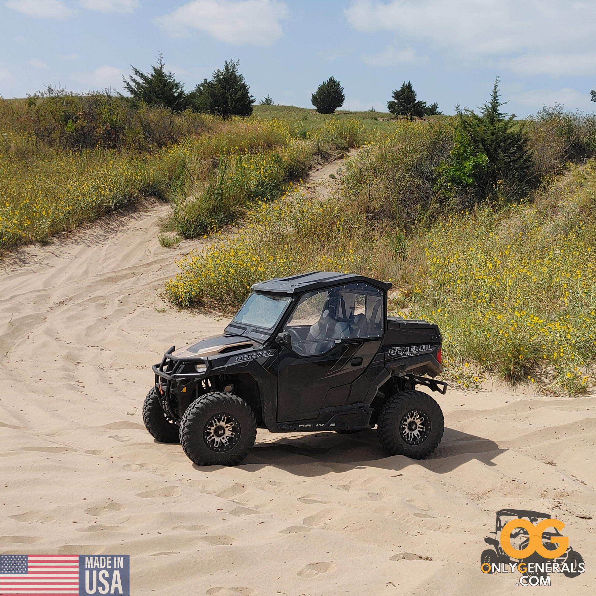 Out in the sand, a Polaris General showcasing the OnlyGenerals SideskinsLITE hard upper doors