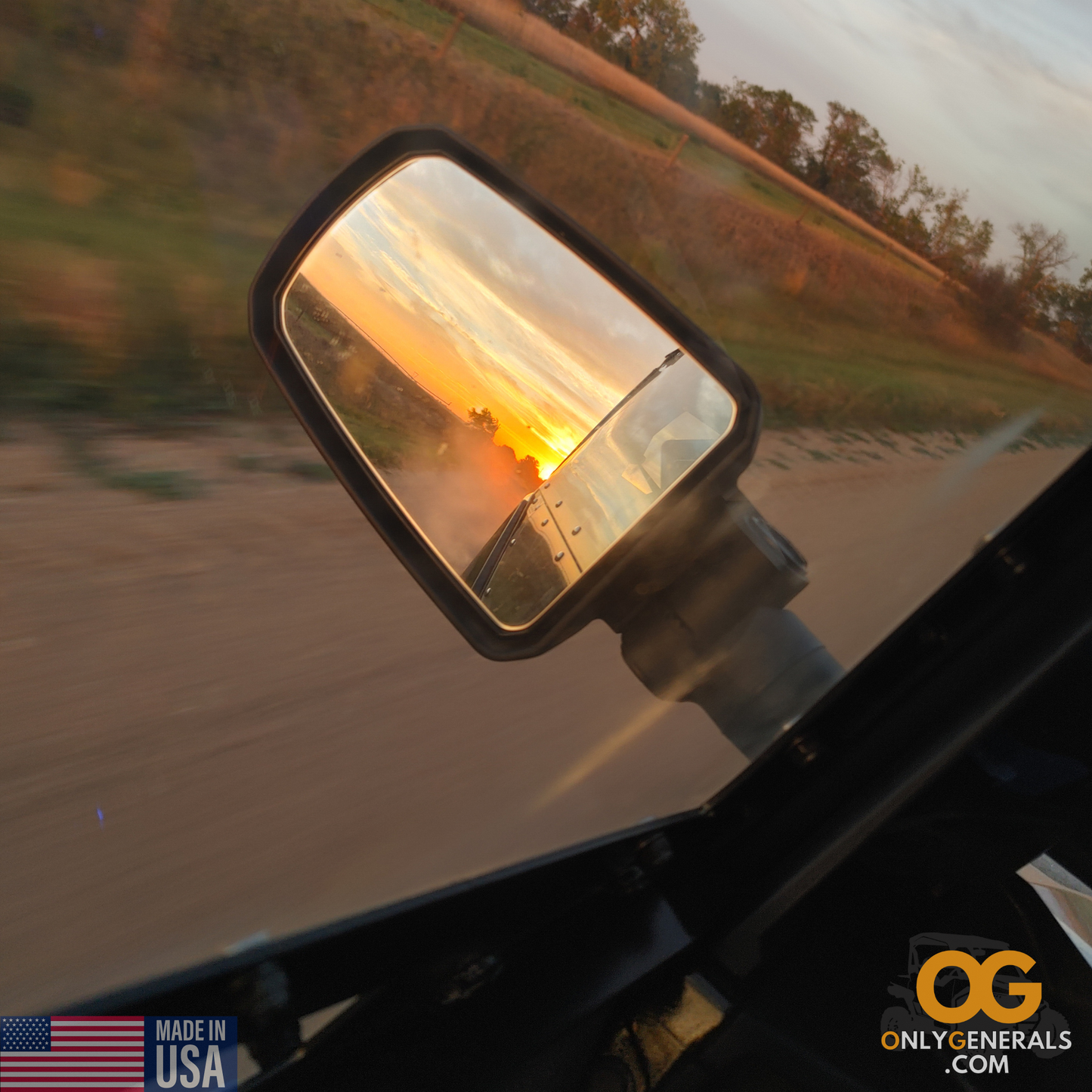 A beautiful & side shot of the OnlyGenerals SideskinsLITE hard upper doors while cruising down a gravel road with the Polaris General