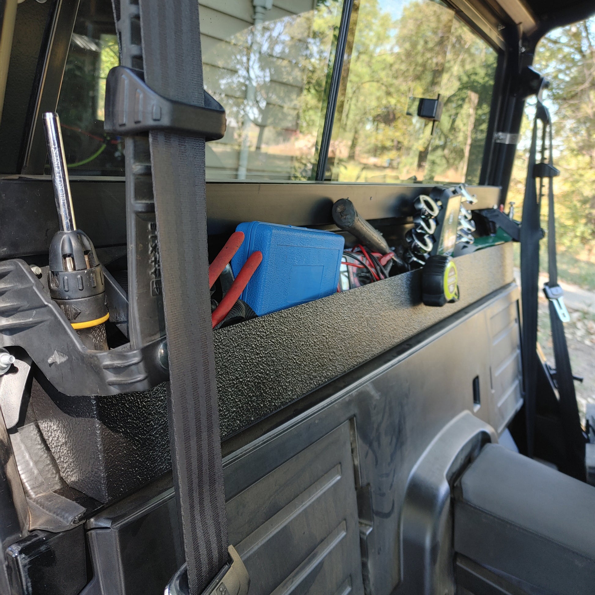 OnlyGenerals Polaris General 50 inch full length behind seat storage tray full of tools.